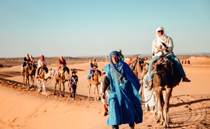 CAMEL TREKKING ACROSS ERG CHEBBI